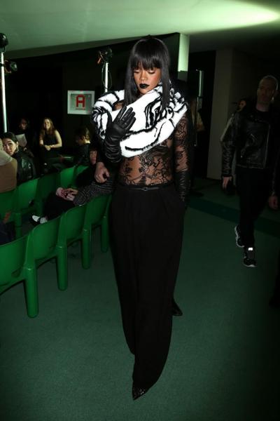 16P Rihanna braless in a black see-through top at Jean Paul Gaultier fashion show in