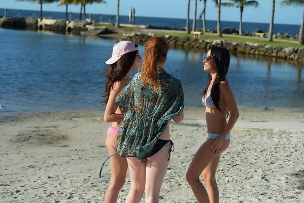 16P Lisa Opie tanning her perfect body in bright colored thong bikini at Miami Beach