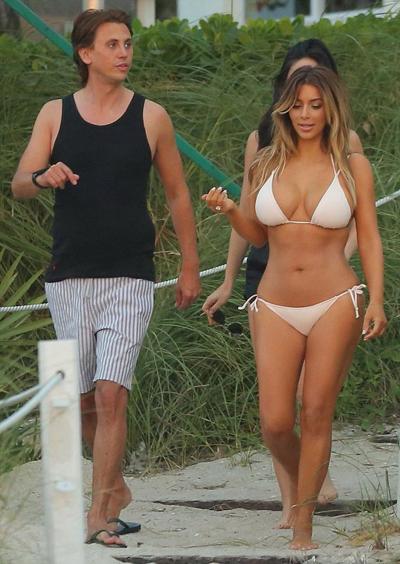 16P Kim Kardashian showing off her curvy bikini body on a beach in Miami