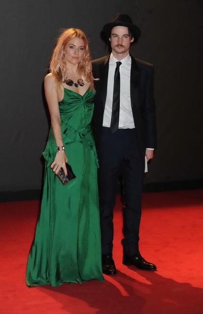 16P Sienna Miller shows huge cleavage braless in a high slit green dress at the 2013