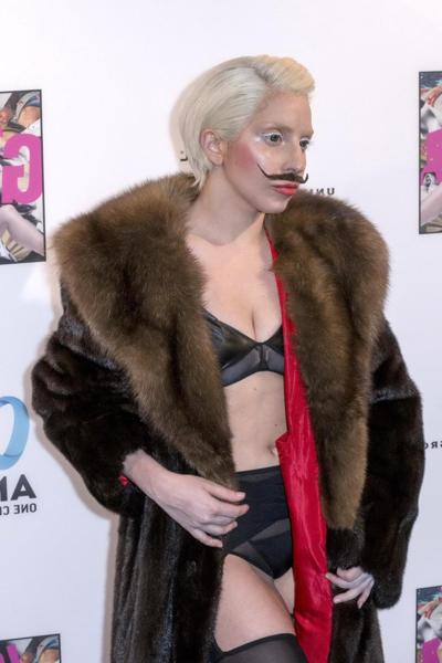 16P Lady Gaga wearing lingerie and fake moustache at her album promotion in Berlin