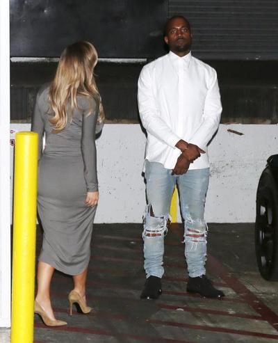 16P Kim Kardashian showing big cleavage in a high slit gray dress outside Dash bouti