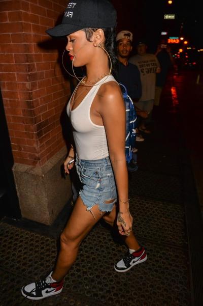 16P Rihanna braless wearing tight white see-through top and hotpants arriving at her