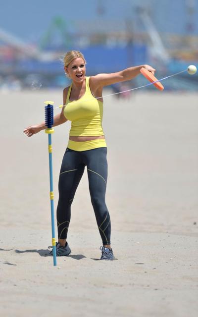 16P Carrie Keagan showing huge cleavage in yellow tank top and tights while working 