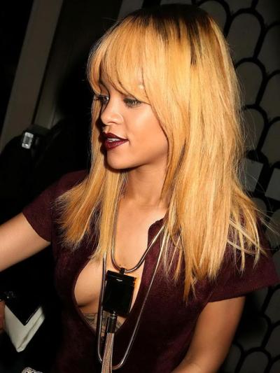 16P Rihanna braless shows cleavage wearing a wide open catsuit for the Azzedine Alai