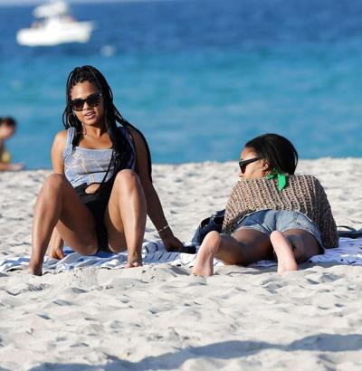 16P Christina Milian exposing nipples slip in bikini on beach
