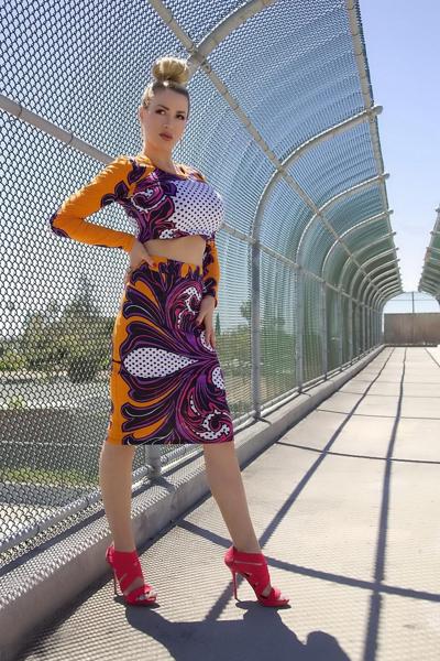 15P Jordan Carver exposing her curvy body in a belly top and mini skirt at Bridge Bi