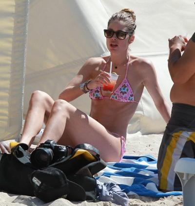 16P Doutzen Kroes wearing tiny pink bikini on the beach in Miami
