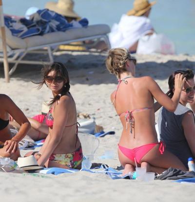 16P Nina Dobrev showing off her floral bikini booty at the beach in Miami