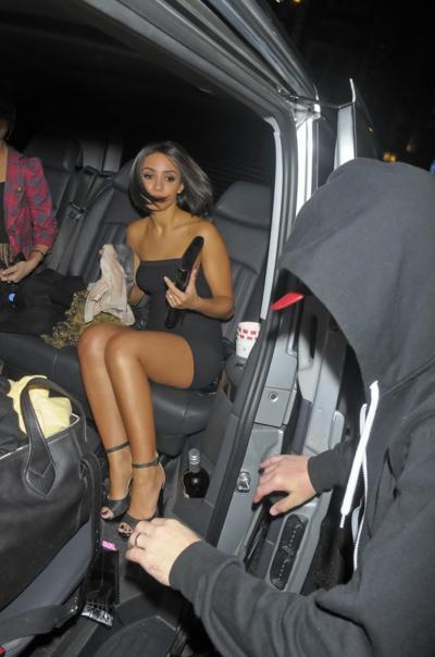 10P Frankie Sandford stunning in black tube mini dress at the Freedom Bar in London