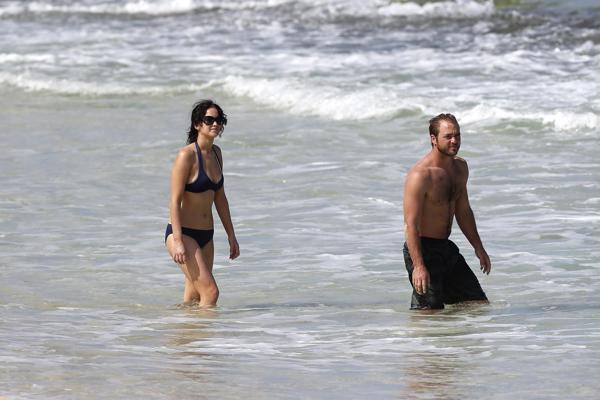 10P Jennifer Lawrence wearing skimpy dark blue bikini at a beach in Hawaii