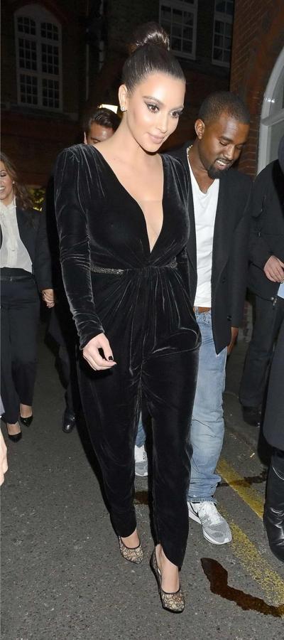 10P Kim Kardashian shows cleavage  pokies wearing a sexy black outfit outside a rest