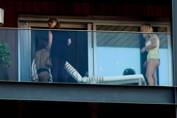 10P Lady Gaga topless on a hotel balcony in Rio trying to hide her boobs