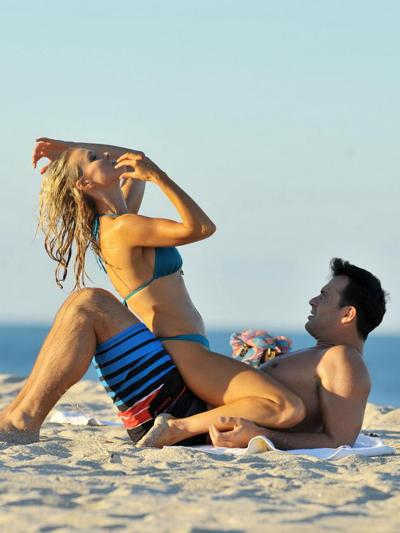 10P Joanna Krupa in bikini showing pokies  ass while humping her boyfriend on a beac