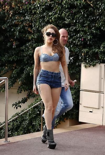 10P Lady Gaga looks hot wearing skimpy bikini top and denim shorts at Les Pirates re