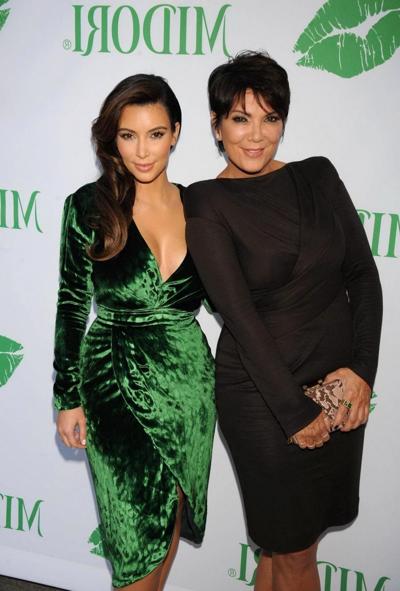 10P Kim Kardashian shows huge cleavage wearing green high slit dress at Midori Makeo