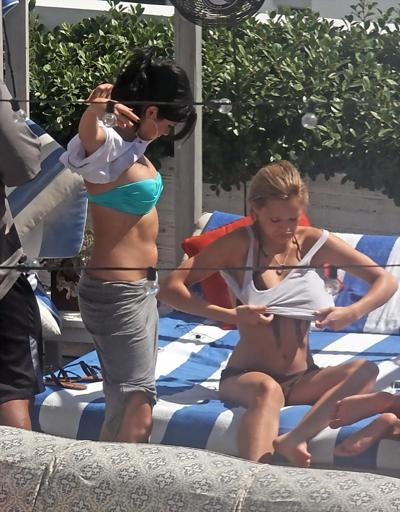 10P Selena Gomez showing cameltoe and big boobs in light blue tube bikini at a pool 