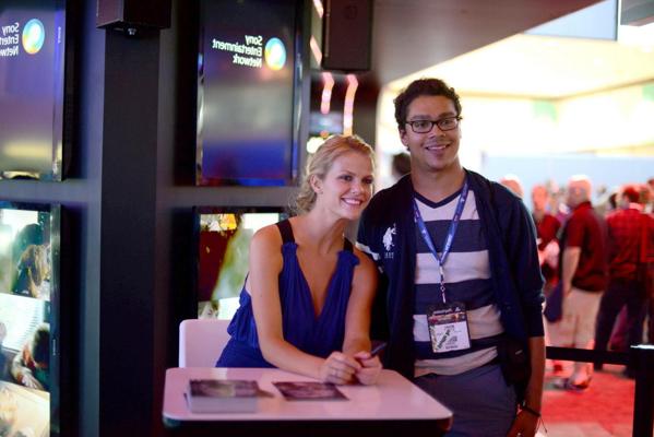10P Brooklyn Decker showing big cleavage in blue mini dress at PlayStation booth at 
