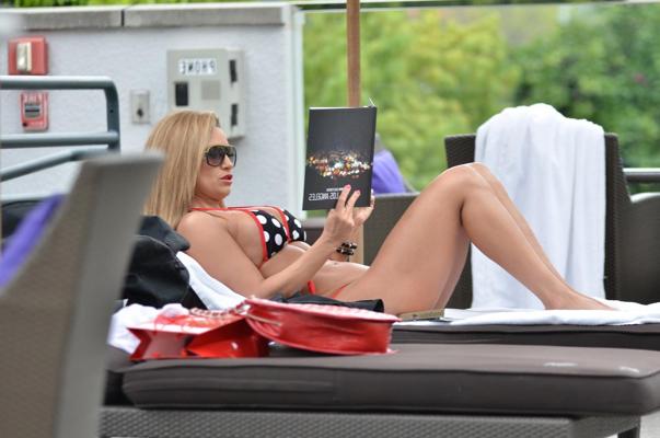 10P Jennifer Nicole Lee showing off her fit body wearing a polka dot bikini poolside