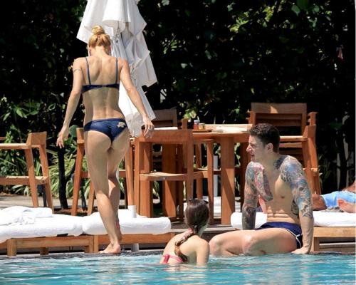 10P Michelle Hunziker showing off her bikini body at the pool in Miami