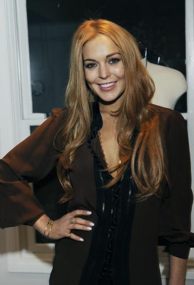 16P Lindsay Lohan showing big cleavage in hot mini skirt at Eva Fehren Jewelry Show 