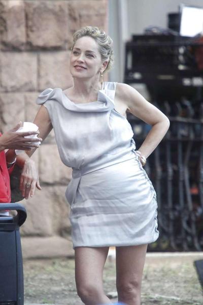16P Sharon Stone showing her panties upskirt while spread cream on her legs