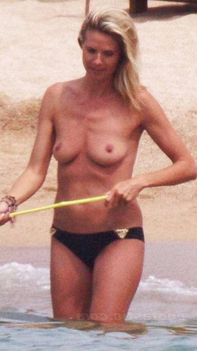16P Heidi Klum showing her tiny tits on beach while sunbathing topless caught by pap