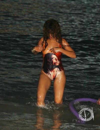 16P Rihanna all wet and sexy in swimsuit on beach caught by paparazzi