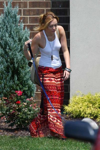 16P Miley Cyrus smoking cigars and exposing her hard nipples in see thru blouse