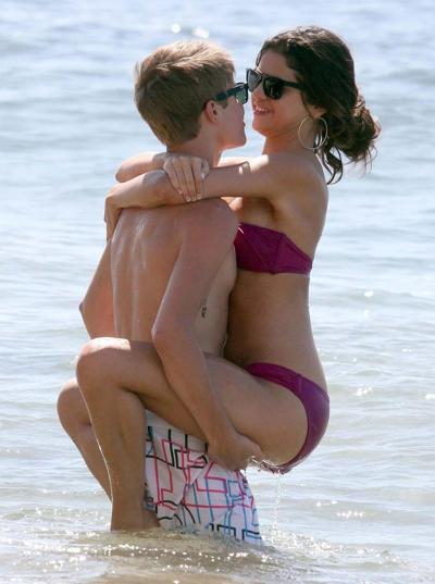 16P Selena Gomez exposing her sexy body and hot ass in bikini on beach
