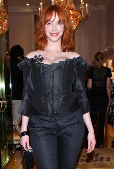 16P Christina Hendricks showing huge cleavage at Vivienne Westwood LA store opening