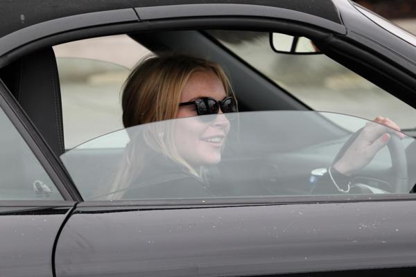 16P Lindsay Lohan showing off her big boobs wearing see-through top in LA