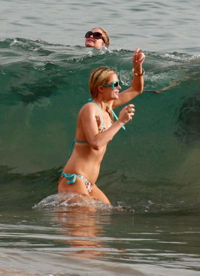 10P Paris Hilton looking sexy in colorfull bikini on beach with her boyfriend papara