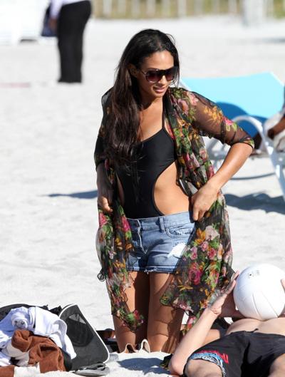 16P Alesha Dixon wearing sexy black swimsuit  denim shorts on the beach in Miami