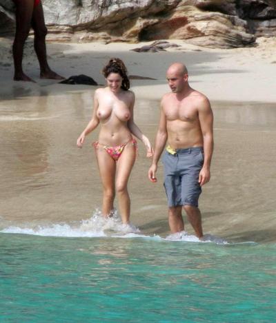10P Kelly Brook showing big cleavage and upskirt in car and topless on beach