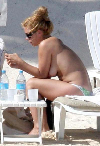 15P Billie Piper sunbathing topless on the beach