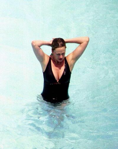 10P Melanie Griffith exposing her nice big tits and hairy pussy in photoshoot