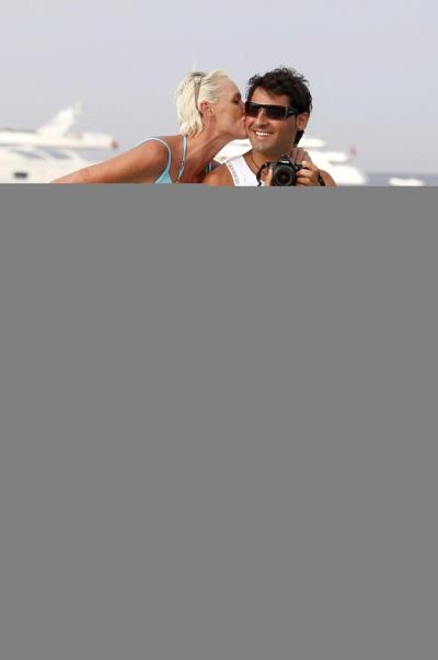 16P Brigitte Nielsen leggy wearing tiny summer dress on a holiday in Saint Tropez