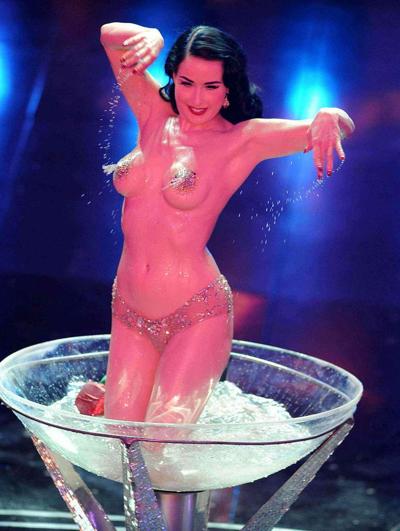 16P Dita Von Teese looking sexy in red outfit and exposing her tits