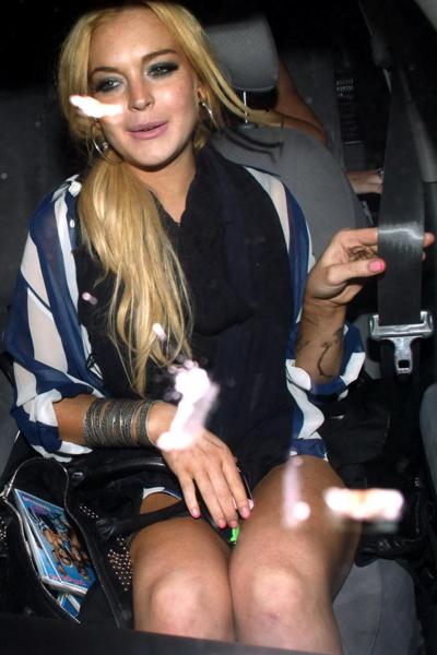 15P Lindsay Lohan leggy  in see-through top leaving her apartment in West Hollywood