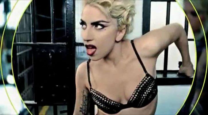 10P Lady Gaga in some strange outfit and posing topless