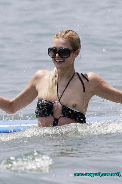 10P Paris Hilton showing her nice ass in thong on balcony and in see thru dress