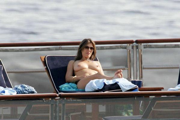 16P Elizabeth Hurley sunbathing in topless and showing extremely huge tits