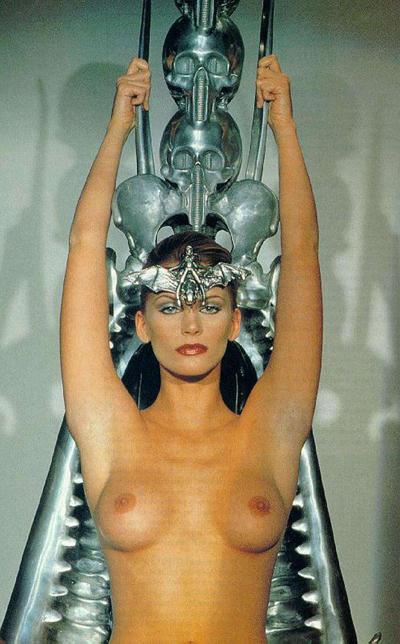 16P Natasha Henstridge exposing her nice big tits and posing in bikini