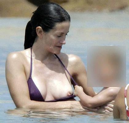 10P Courteney Cox posing in lingerie and tits slip paparazzi pictures
