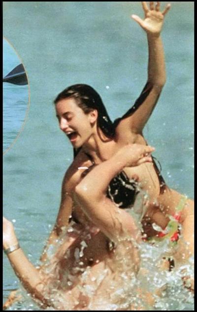 15P Penelope Cruz showing sweet topless on the beach