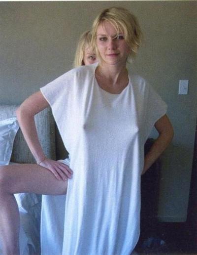 15P Celebrity Kirsten Dunst nice nipple slip on the beach