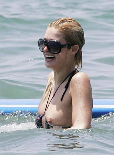 16P paris hilton caught by paparazzi in nipple slip action