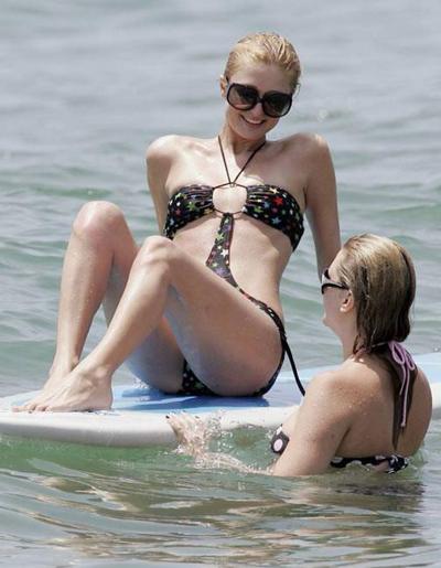 16P Celeb superstar Paris Hilton shows perky tits in the sea