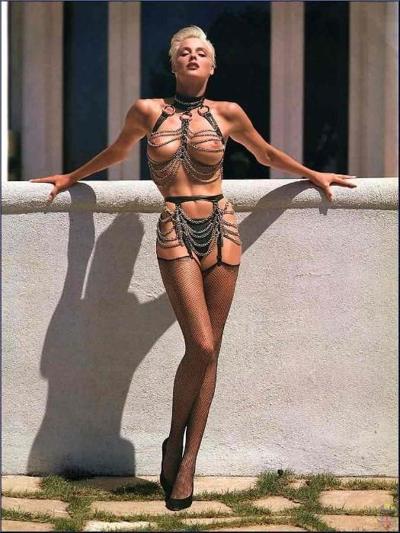 16P Brigitte Nielsen topless paparazzi pictures and flashing pussy